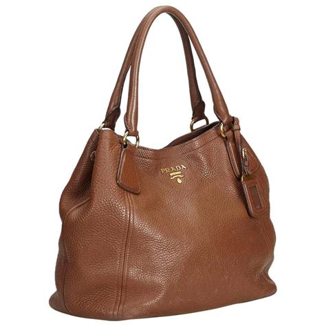 prada brown vitello daino pebbled leather buckle tote bag|Prada vitello daino bag.